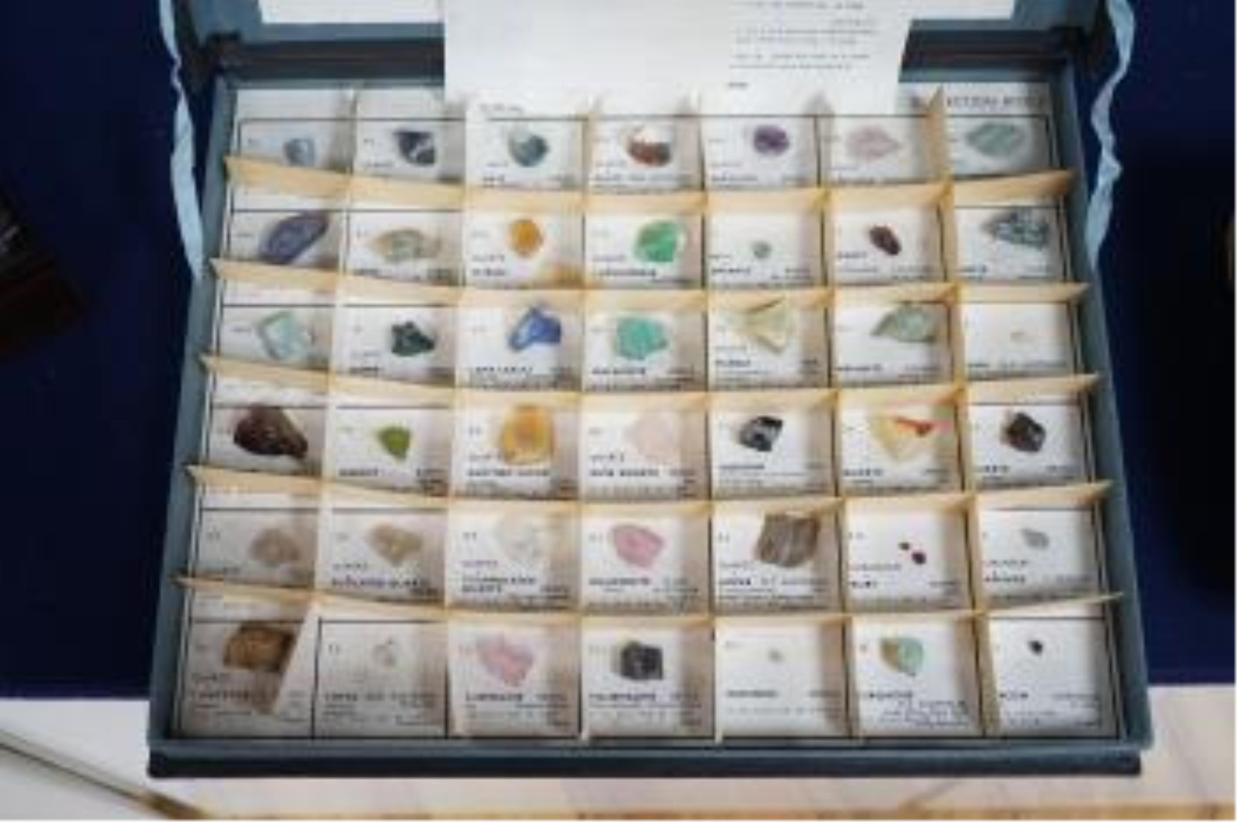 Three boxes containing unmounted cut gemstones including topaz, citrine, peridot, zircon, moonstone, etc. Condition - fair